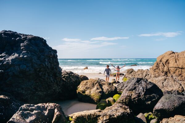Family playing int he rock pools